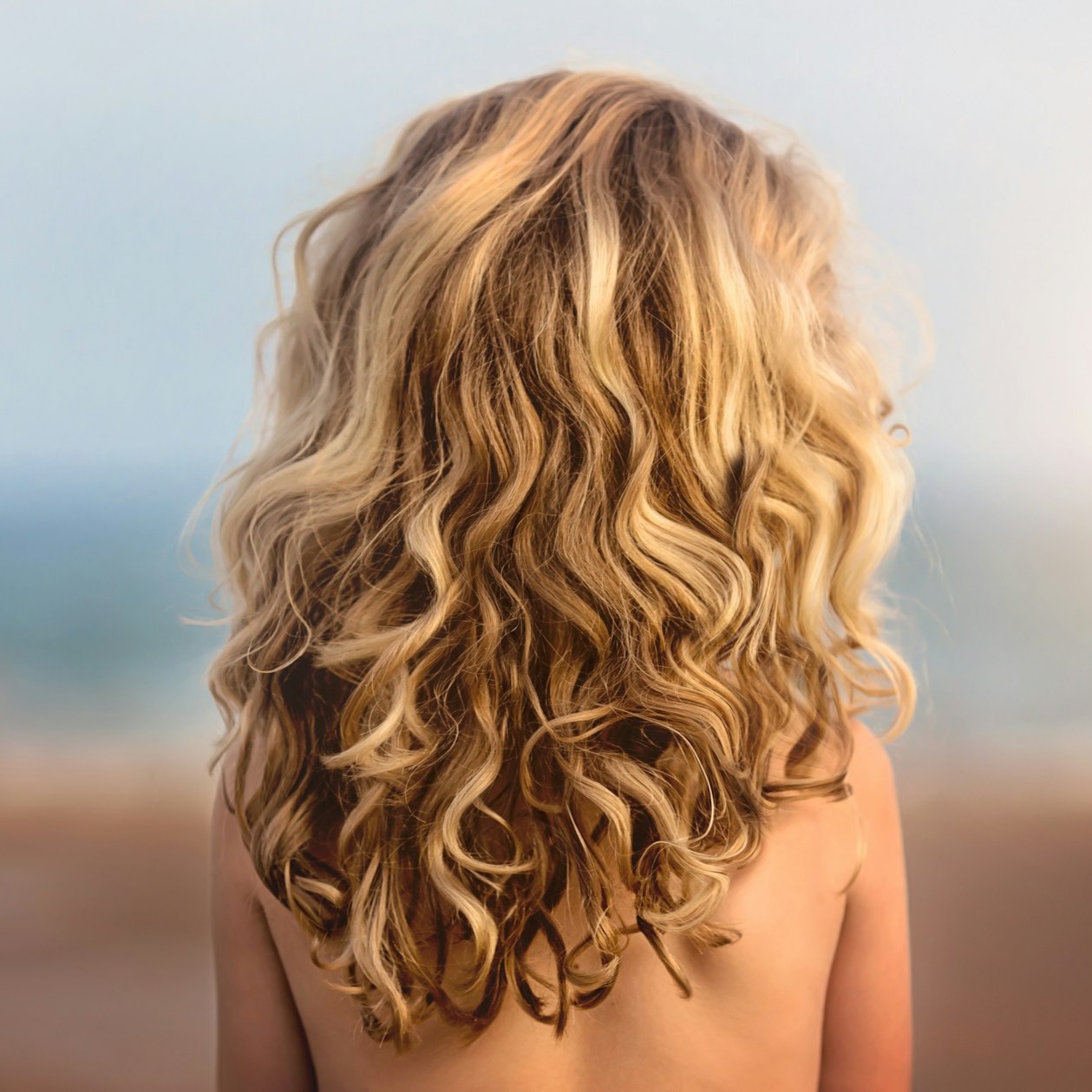 a woman with beautiful curls