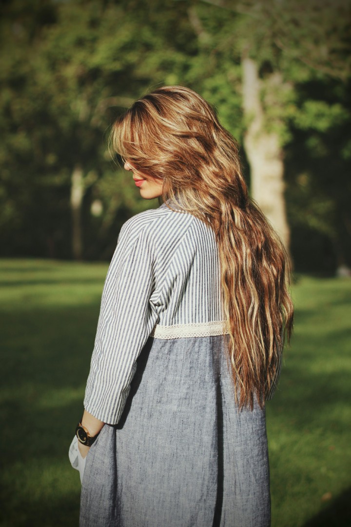 a woman with long wavy hair