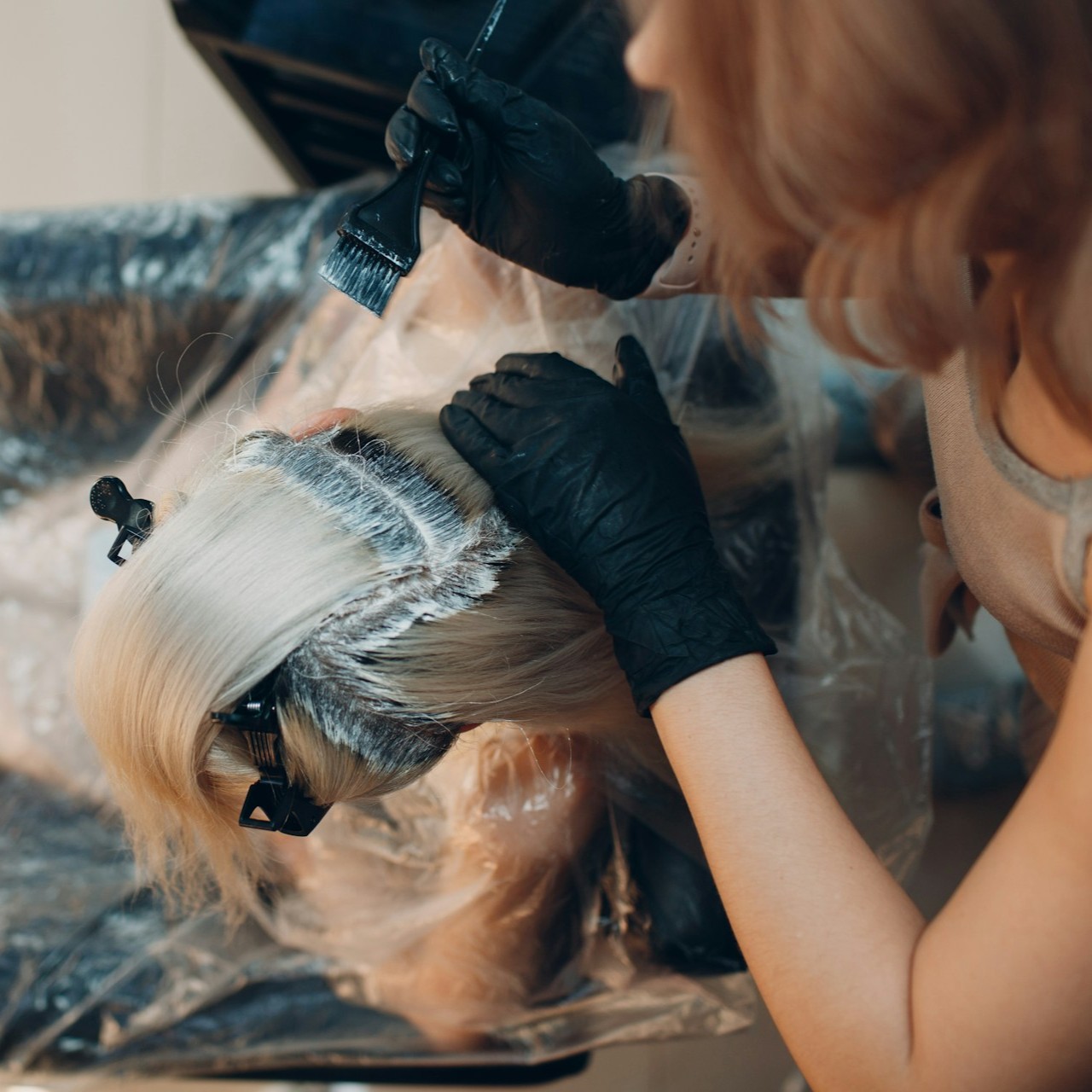 a woman getting a root touch-up